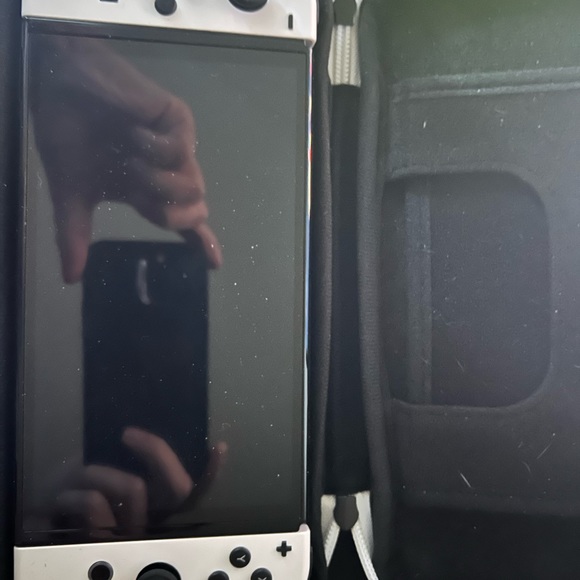 Nintendo oled switch with 3 games. Basically brand new. Just sits in the case.